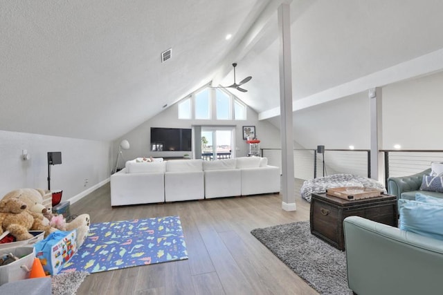 bedroom with lofted ceiling and light wood-type flooring