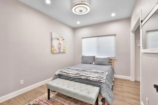 bedroom with light wood-type flooring