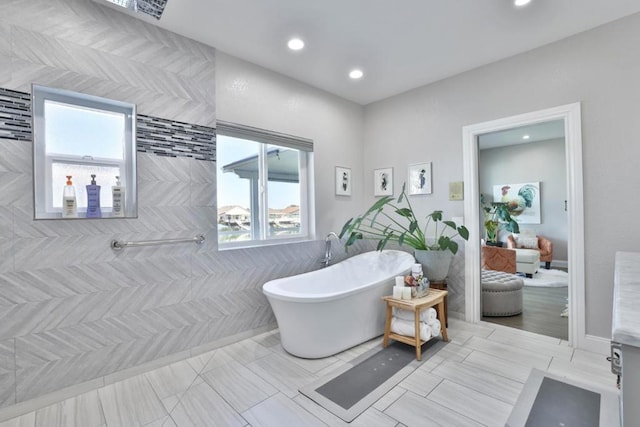 bathroom with a healthy amount of sunlight and a bathtub