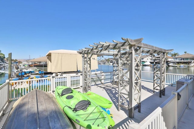 exterior space featuring a water view and a pergola