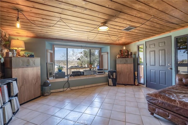 entrance foyer featuring light tile patterned floors and wood ceiling