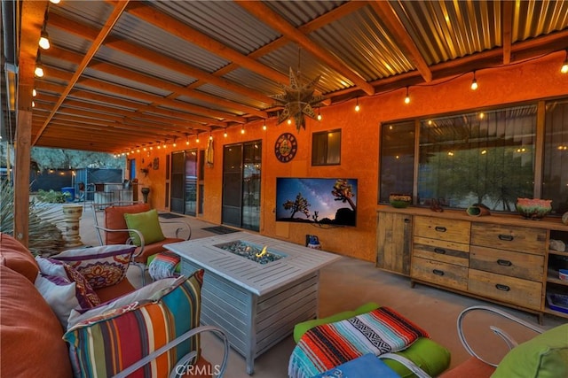 view of patio / terrace featuring an outdoor living space with a fire pit