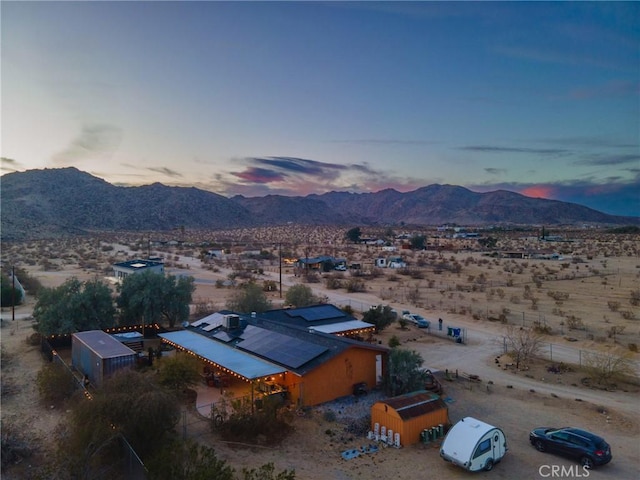 aerial view at dusk with a mountain view