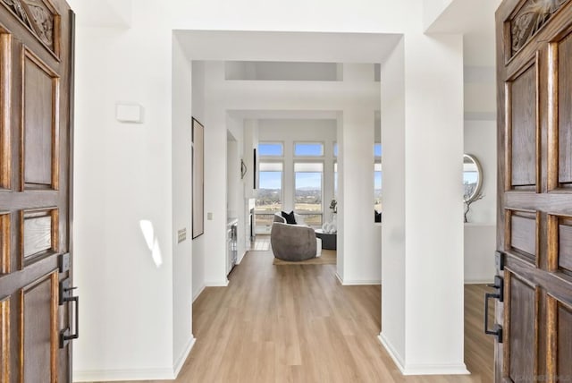 entryway with light hardwood / wood-style flooring