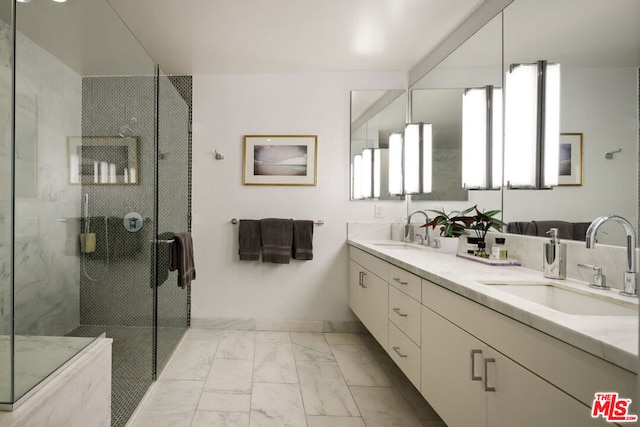 bathroom with vanity and a shower with shower door