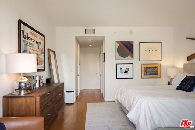 bedroom with light hardwood / wood-style floors