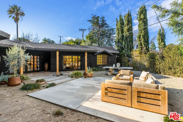 view of patio featuring outdoor lounge area and french doors