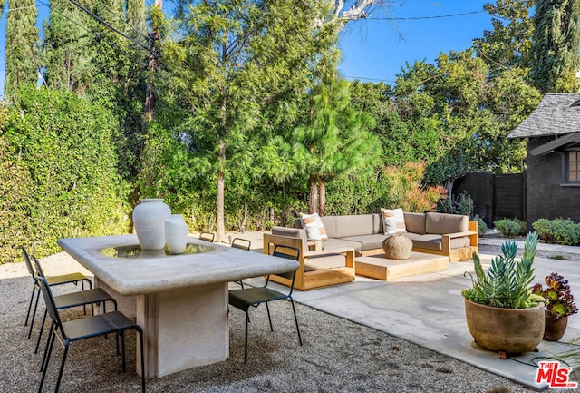 view of patio featuring outdoor lounge area and exterior bar