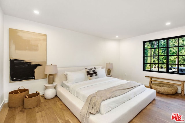 bedroom with light hardwood / wood-style floors