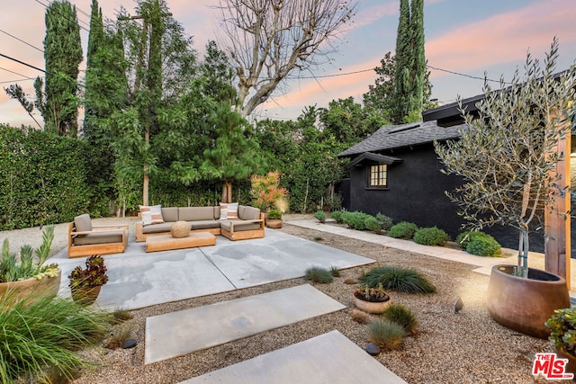 patio terrace at dusk with an outdoor hangout area