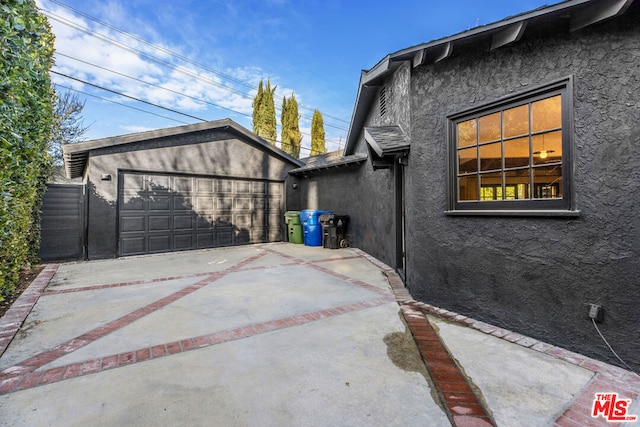 view of property exterior with a garage