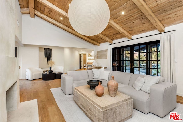 living room with beam ceiling, wooden ceiling, french doors, and light wood-type flooring