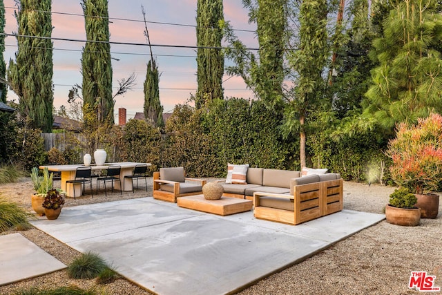 patio terrace at dusk with an outdoor hangout area