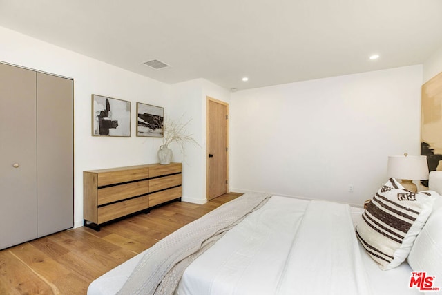 bedroom with light wood-type flooring