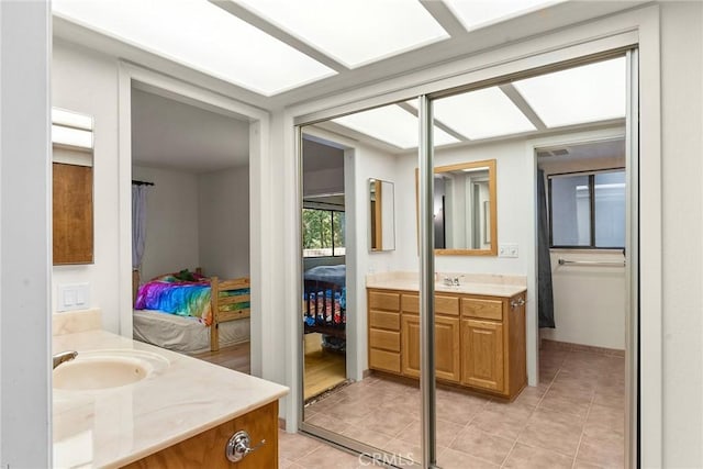 bathroom featuring tile patterned floors and vanity