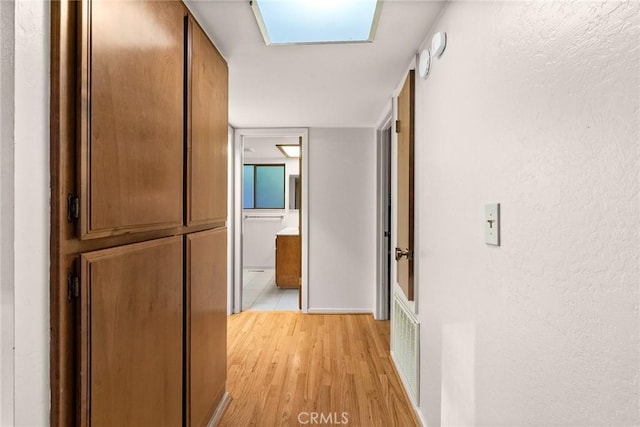 corridor featuring light hardwood / wood-style flooring