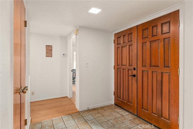 entryway featuring light tile patterned floors