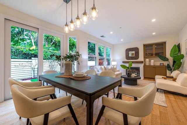 dining area with light hardwood / wood-style floors