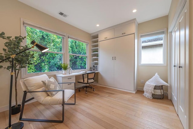 office space with light wood-type flooring