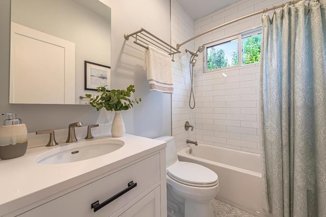 full bathroom with vanity, shower / tub combo, and toilet