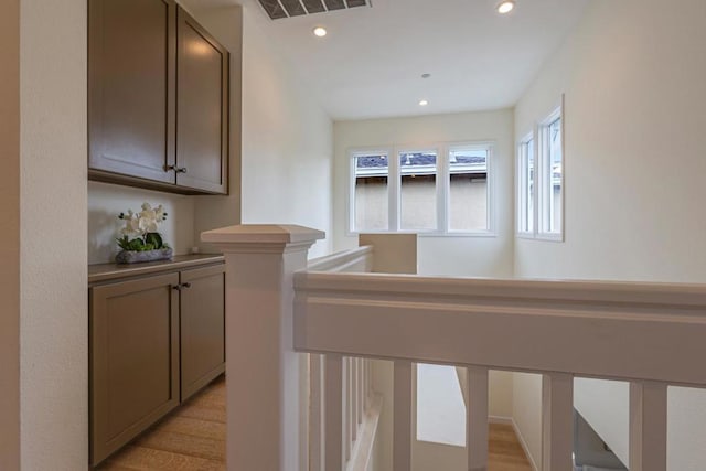 hall with light hardwood / wood-style flooring