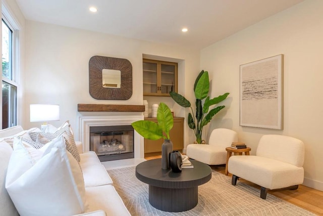 living area with hardwood / wood-style floors