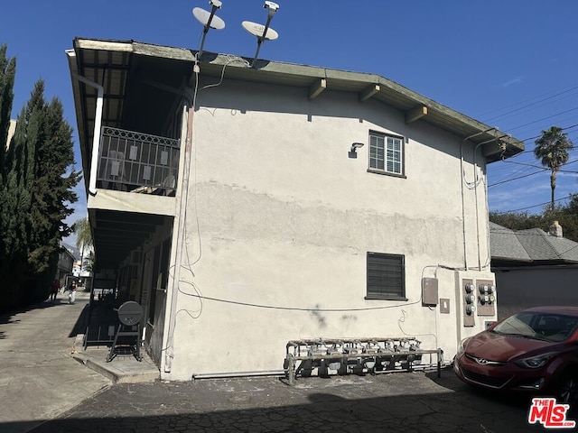 view of home's exterior featuring a balcony