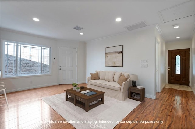 living room featuring crown molding and light wood-type flooring