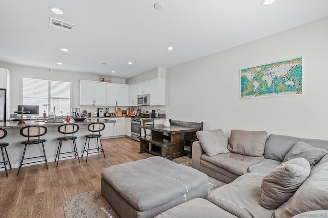 living room with hardwood / wood-style floors