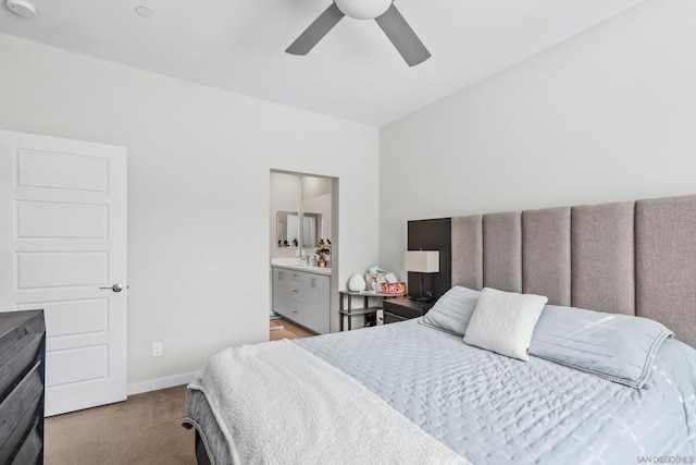 bedroom featuring ensuite bathroom, ceiling fan, and carpet