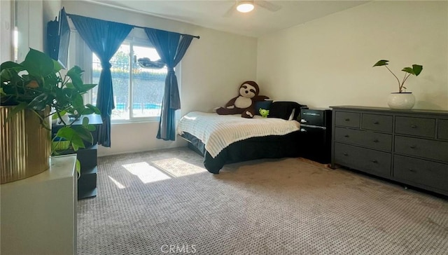 carpeted bedroom with ceiling fan