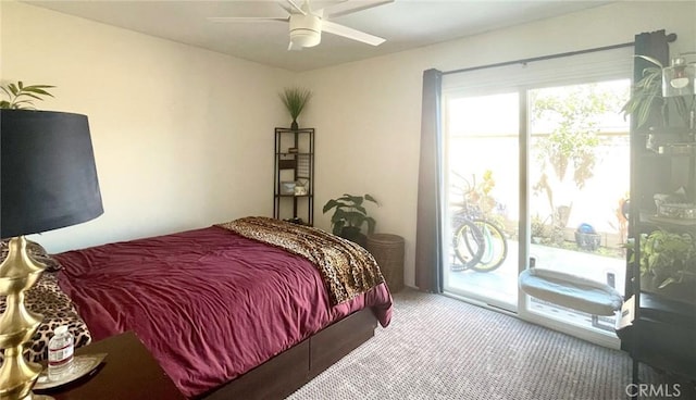 carpeted bedroom featuring access to exterior and ceiling fan