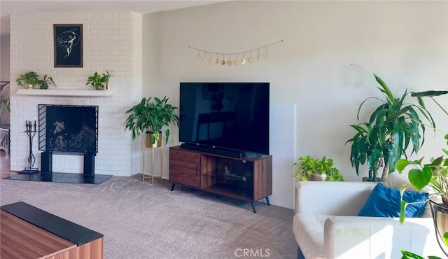 living room featuring carpet floors and a fireplace