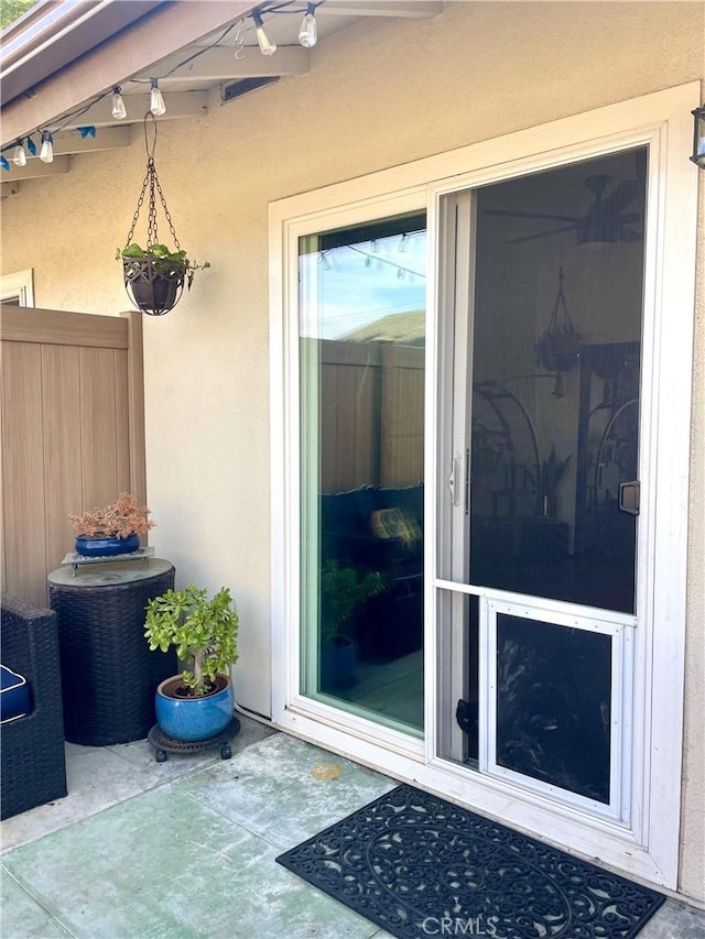 doorway to property with a patio area