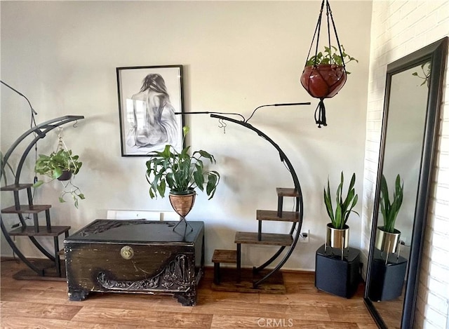 sitting room with hardwood / wood-style flooring