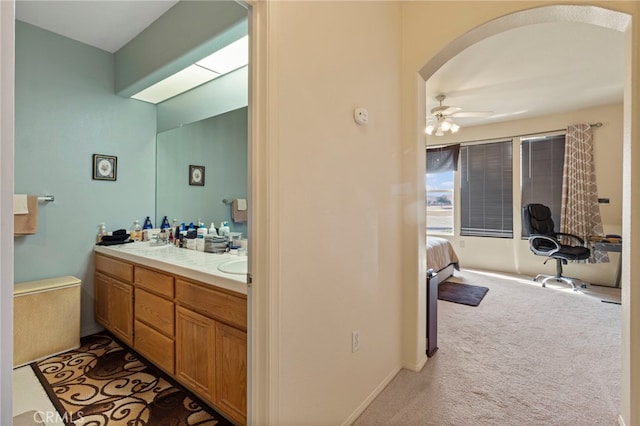 bathroom featuring vanity and ceiling fan