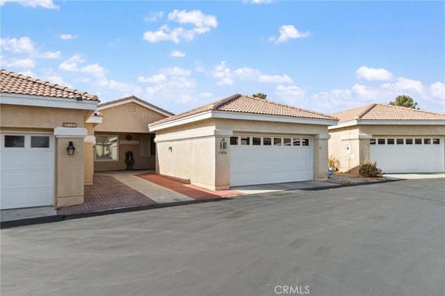 mediterranean / spanish-style home featuring a garage