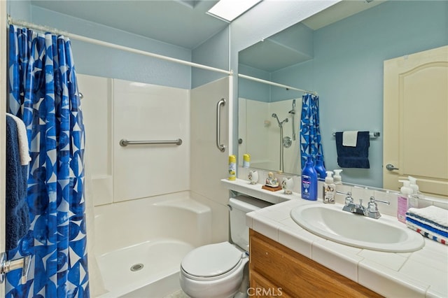 bathroom with vanity, curtained shower, and toilet