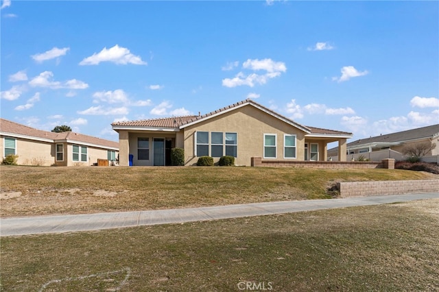 single story home with a front lawn