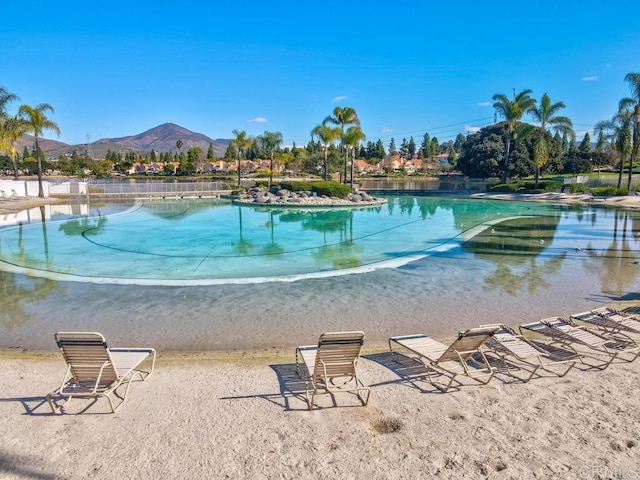 view of pool with a mountain view