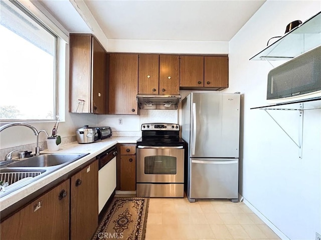 kitchen with sink and appliances with stainless steel finishes