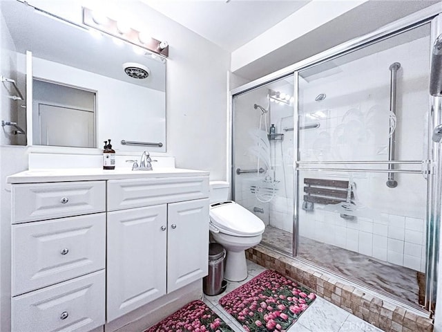 bathroom with walk in shower, tile patterned floors, vanity, and toilet