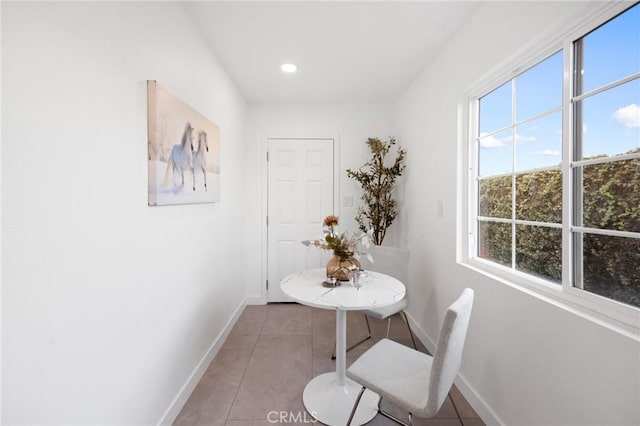 interior space with recessed lighting, light tile patterned flooring, and baseboards