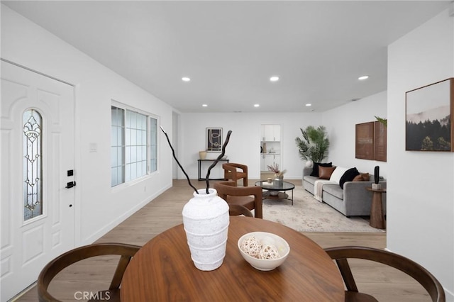 interior space with recessed lighting, baseboards, and light wood finished floors