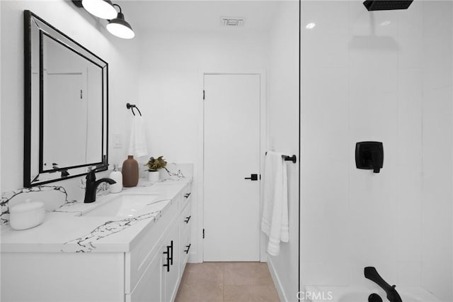 bathroom featuring tile patterned flooring, visible vents, and vanity