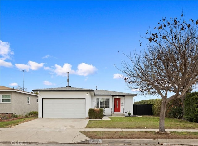 ranch-style house featuring a garage and a front yard