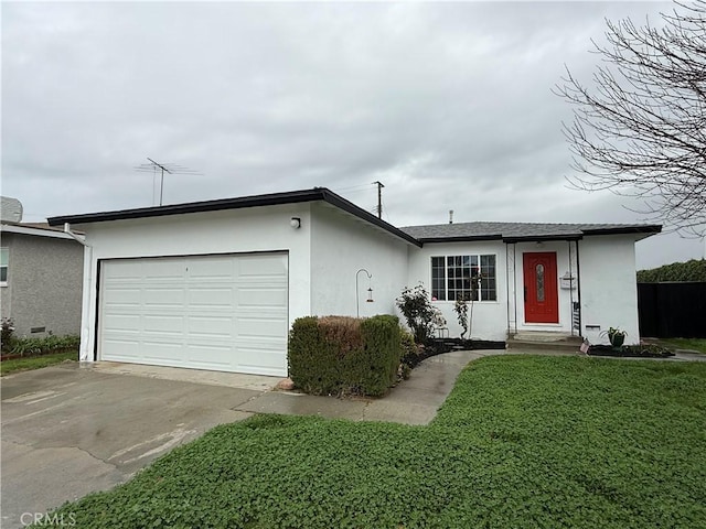 ranch-style home featuring stucco siding, driveway, a front yard, and an attached garage