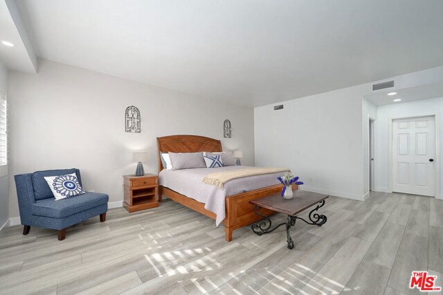 bedroom featuring light wood-type flooring