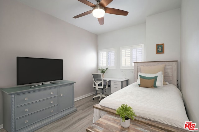 bedroom with light hardwood / wood-style floors and ceiling fan