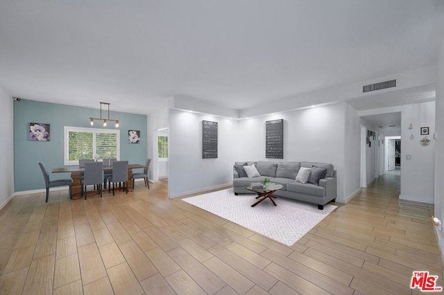 living room with light hardwood / wood-style floors